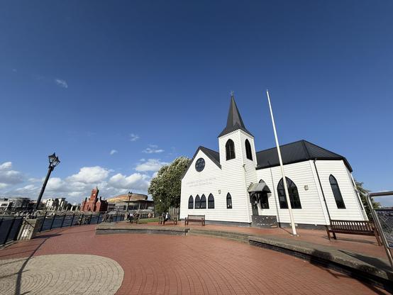 The Norwegian Church Arts Centre with the Pierhead, Millennium Centre and Senedd behind.