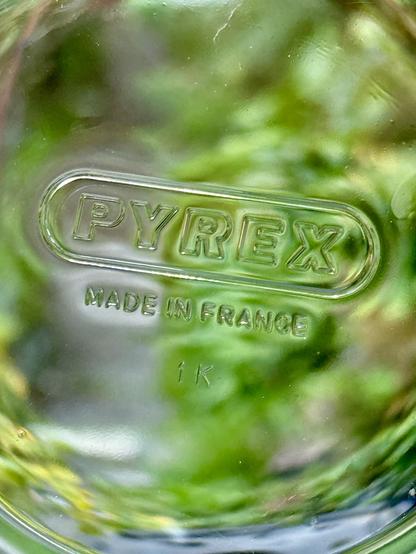 The stamp on the bottom of a glass bowl saying PYREX in upper case and Made in France.