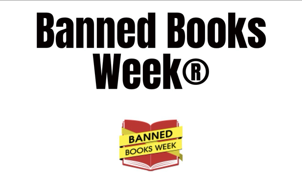 White sign with black lettering that says banned books week with an illustration of a book below wrapped in yellow tape that also says banned books week