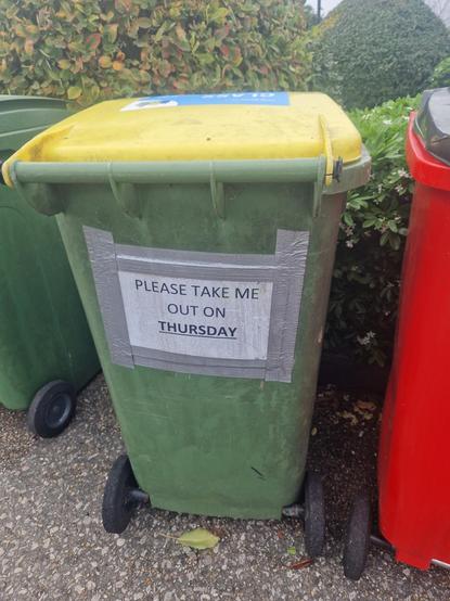 Bin with a sign on that says "please take me out on Thursday"