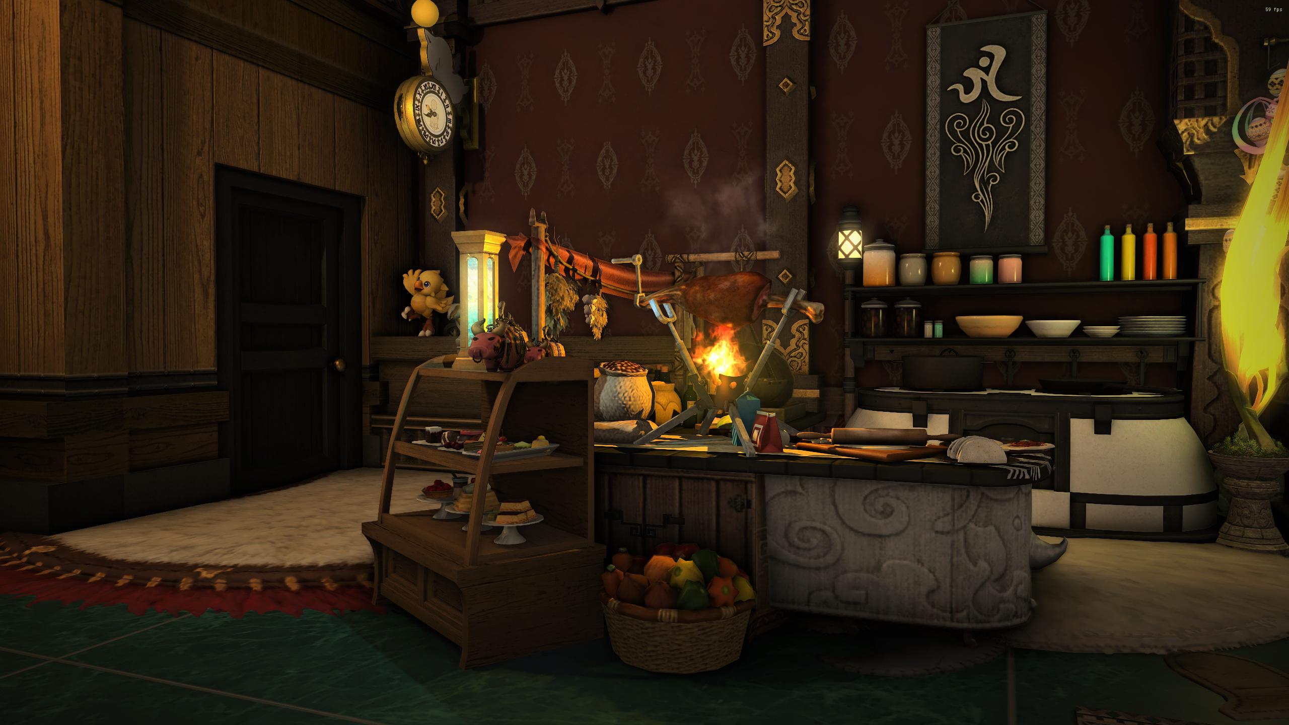 A cozy interior space with wooden walls and a dark door on the left, featuring a round wall clock. The central table holds a burning fire in a cauldron-like pot, surrounded by various tools, bowls, and jars. Shelves to the right display colorful bottles (green, blue, orange) and white bowls, next to a large fire structure with a rug. A wicker basket filled with fruits and a small wooden stand with shelves holding dishes are positioned near the table. A black banner with a white symbol hangs on the dark wall, and the room has a green-tiled floor with rugs.